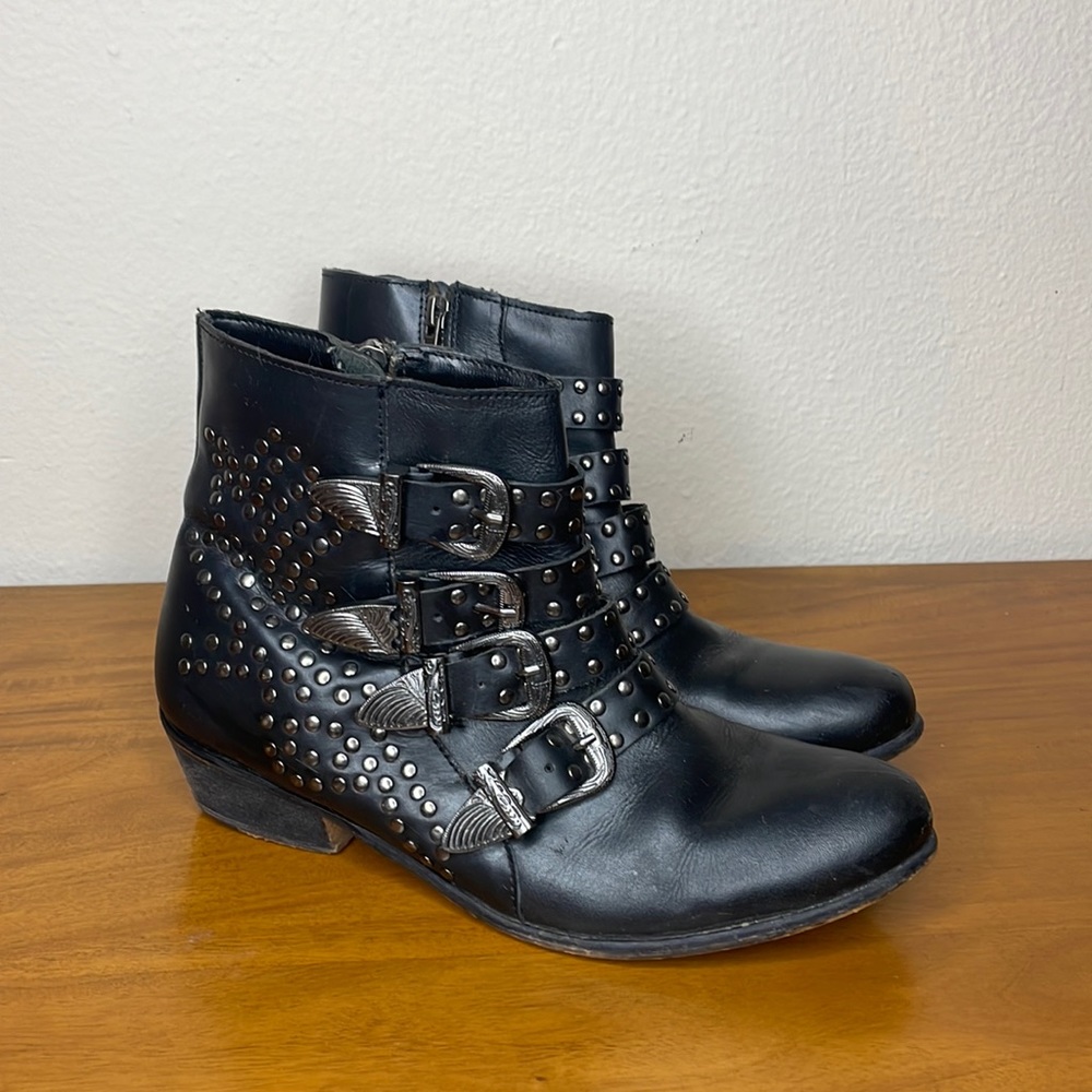 Black faux leather with silver studs and buckles